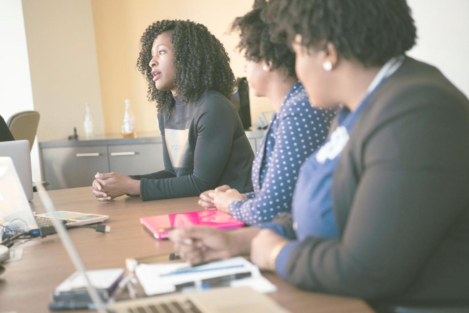 Financial consultation meeting with business owner reviewing analysis reports